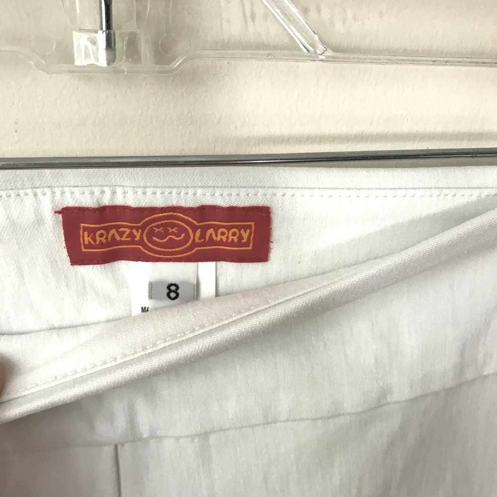 Krazy Larry white pants. Stretchy, pull-on. Rayon, nylon, and spandex.